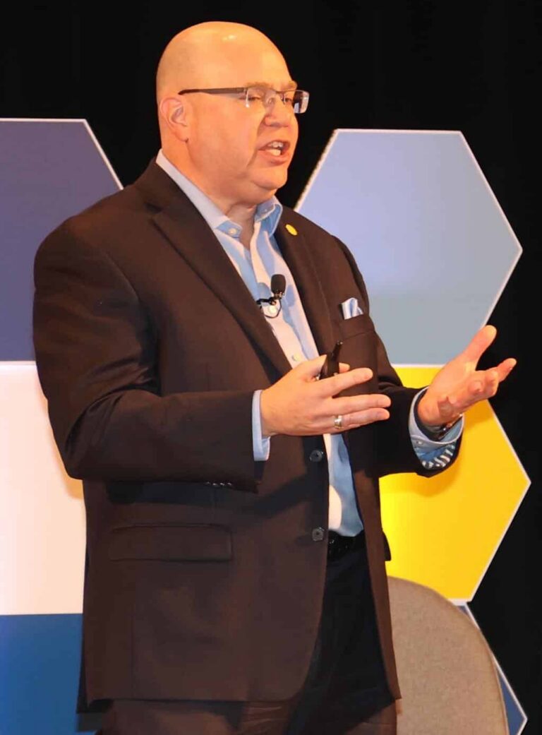 Kevin Sensenig speaking on Commitment-Based Leadership and strategies for precision in organizational execution.