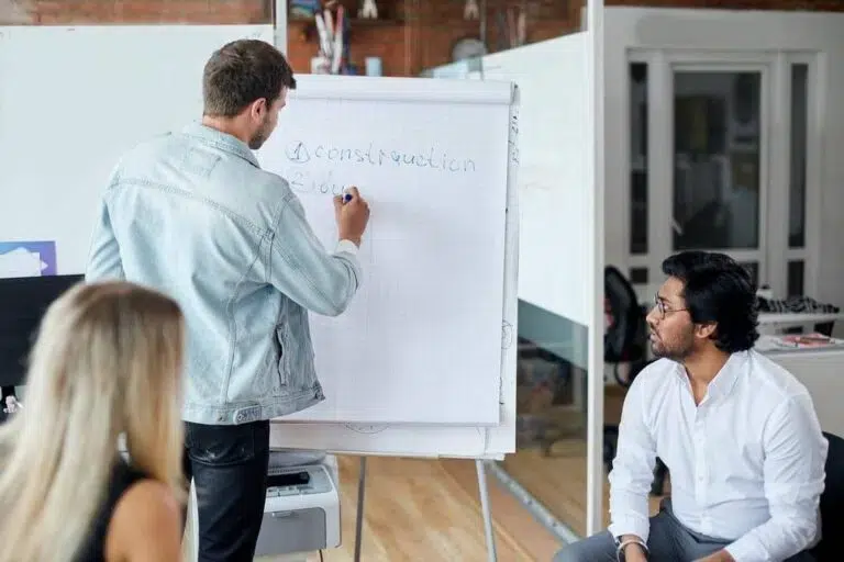 A focused executive coaching session, illustrating over two decades of professional leadership delivery.